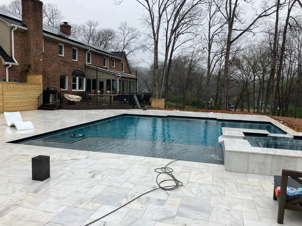 Sophisticated Bianco Marble Pool Edge Detail by Noda Stone