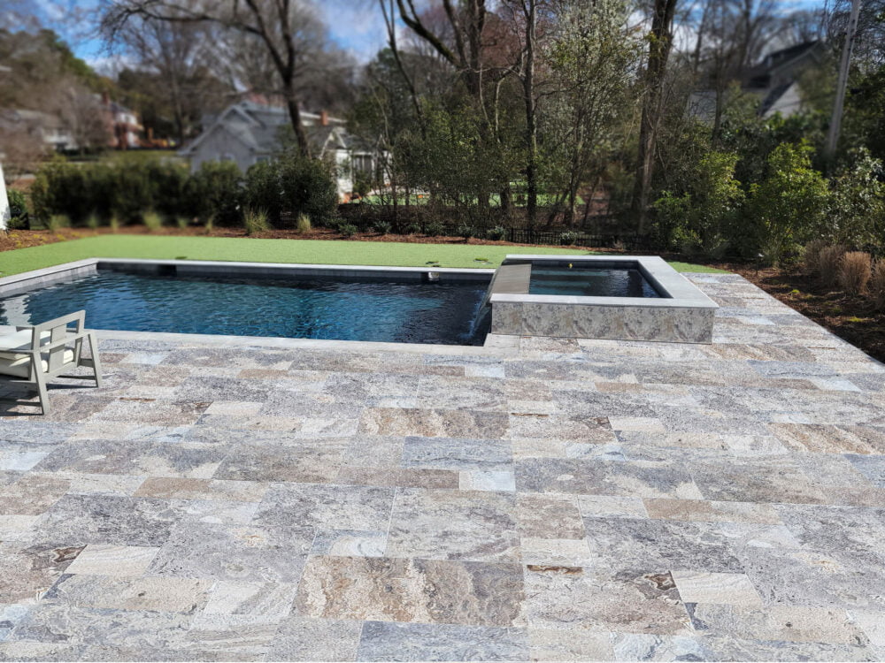 Elegant Silver Travertine Paving in Residential Pool Area