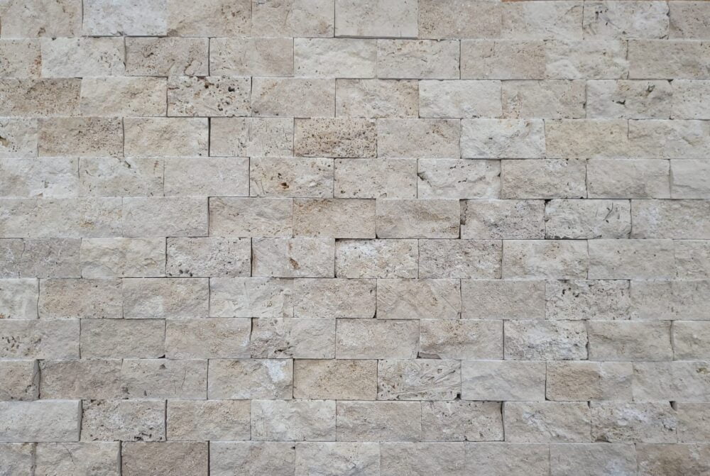 Ivory Travertine 2x4 Split face wall covering by Noda Stone Inc.